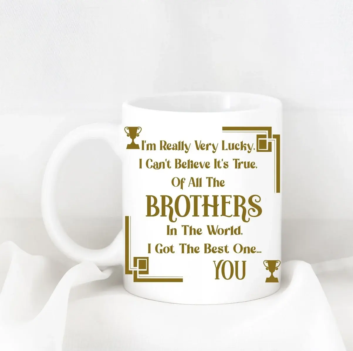 Mug design: gold lettering on a white mug reading “I'm really very lucky… of all the brothers in the world, I got the best one… you”